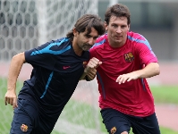 Messi con Lorenzo Buenaventura en el entreno del martes en Sel. Fotos: archivo FCB/Miguel Ruiz-FCB.