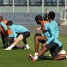 Barça players doing stretch exercises.